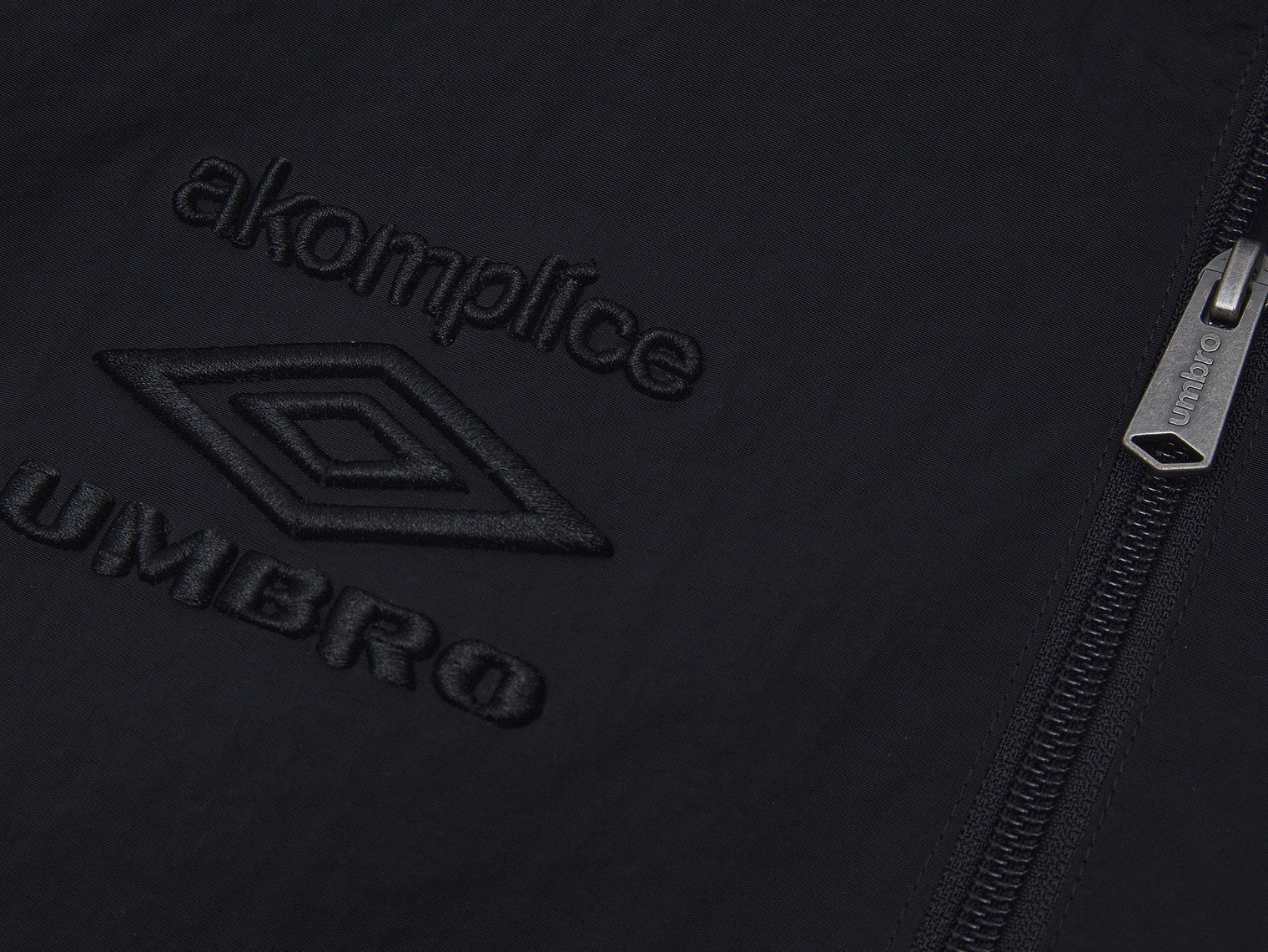 Akomplice x Umbro World Peace Nylon 1/4 Zip (Black)