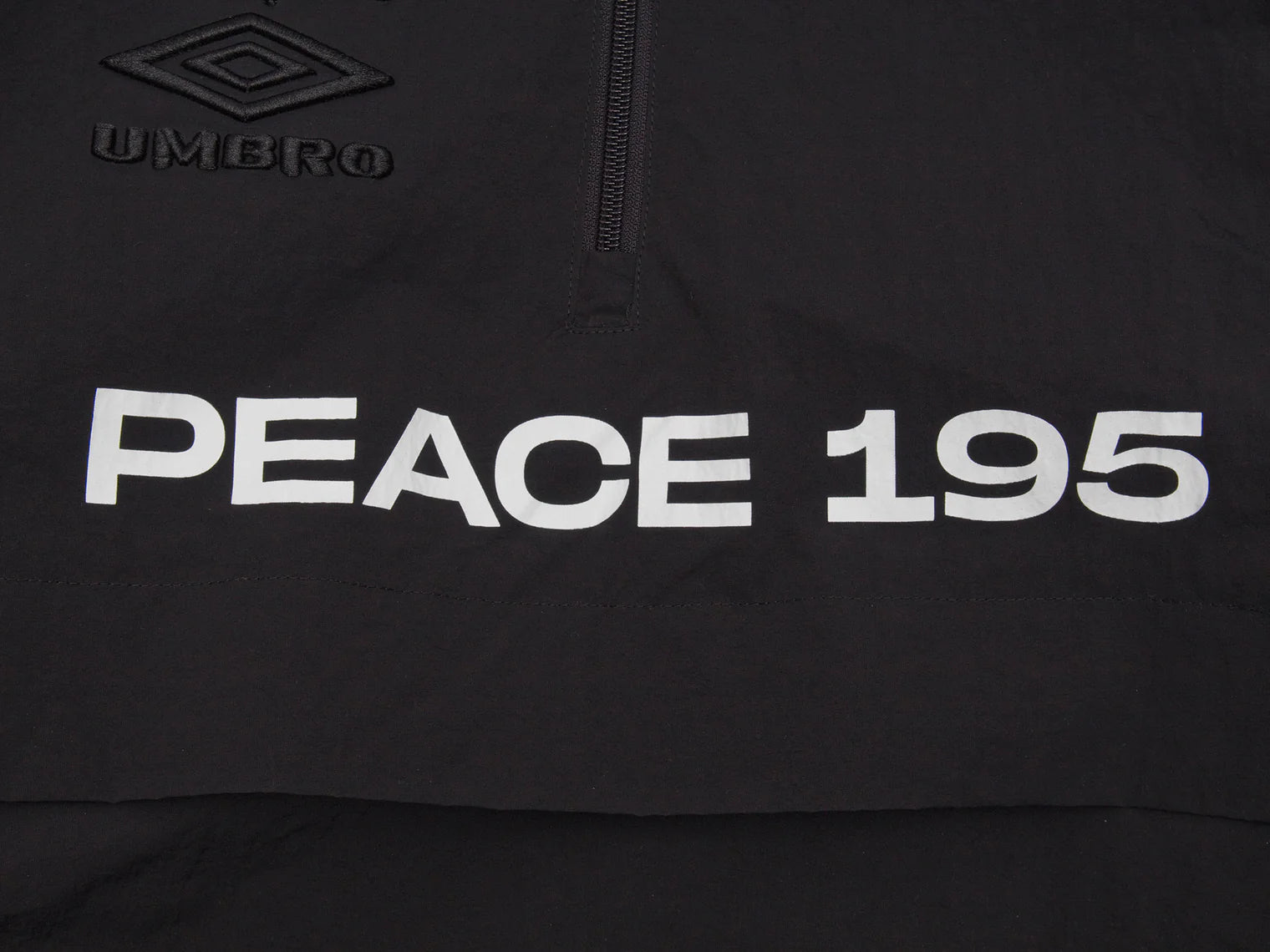 Akomplice x Umbro World Peace Nylon 1/4 Zip (Black)