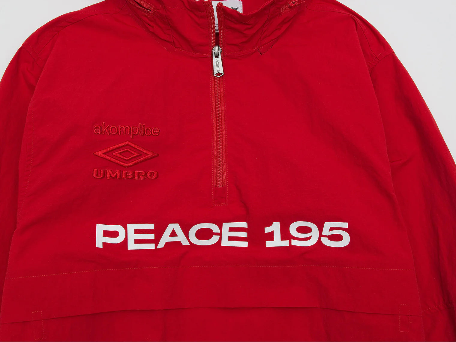 Akomplice x Umbro World Peace Nylon 1/4 Zip (Lychee Red)