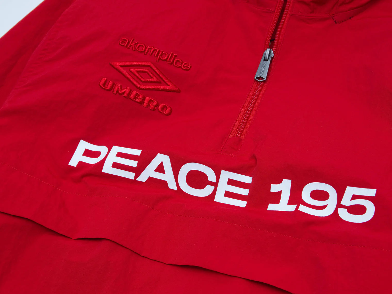 Akomplice x Umbro World Peace Nylon 1/4 Zip (Lychee Red)