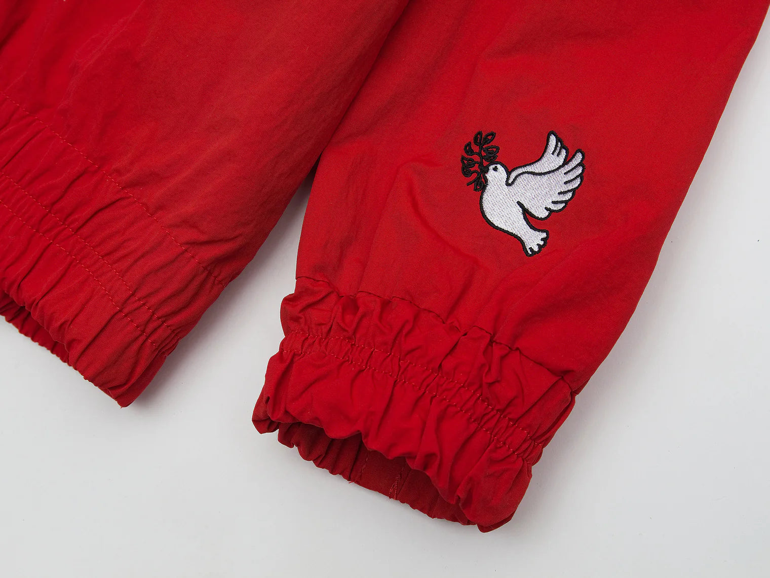 Akomplice x Umbro World Peace Nylon 1/4 Zip (Lychee Red)